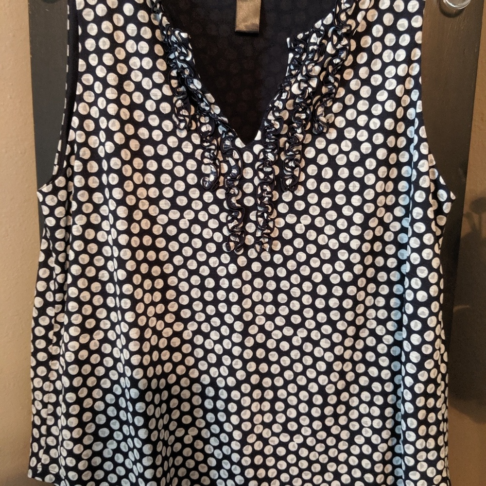 Sleeveless navy and white ruffle polka dot top
